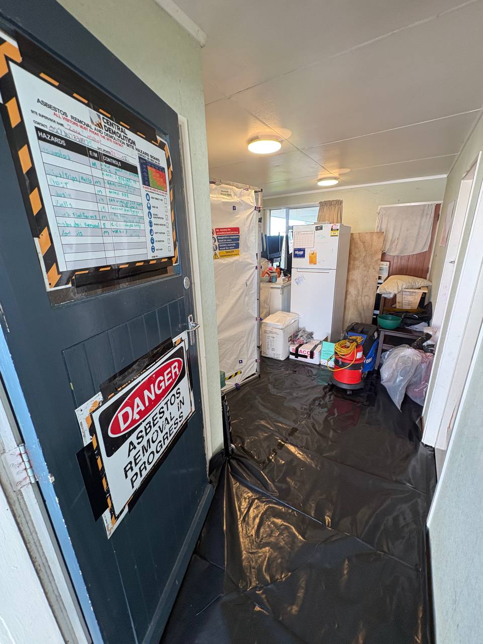 Home is prepped for asbestos removal prior to renovation work.